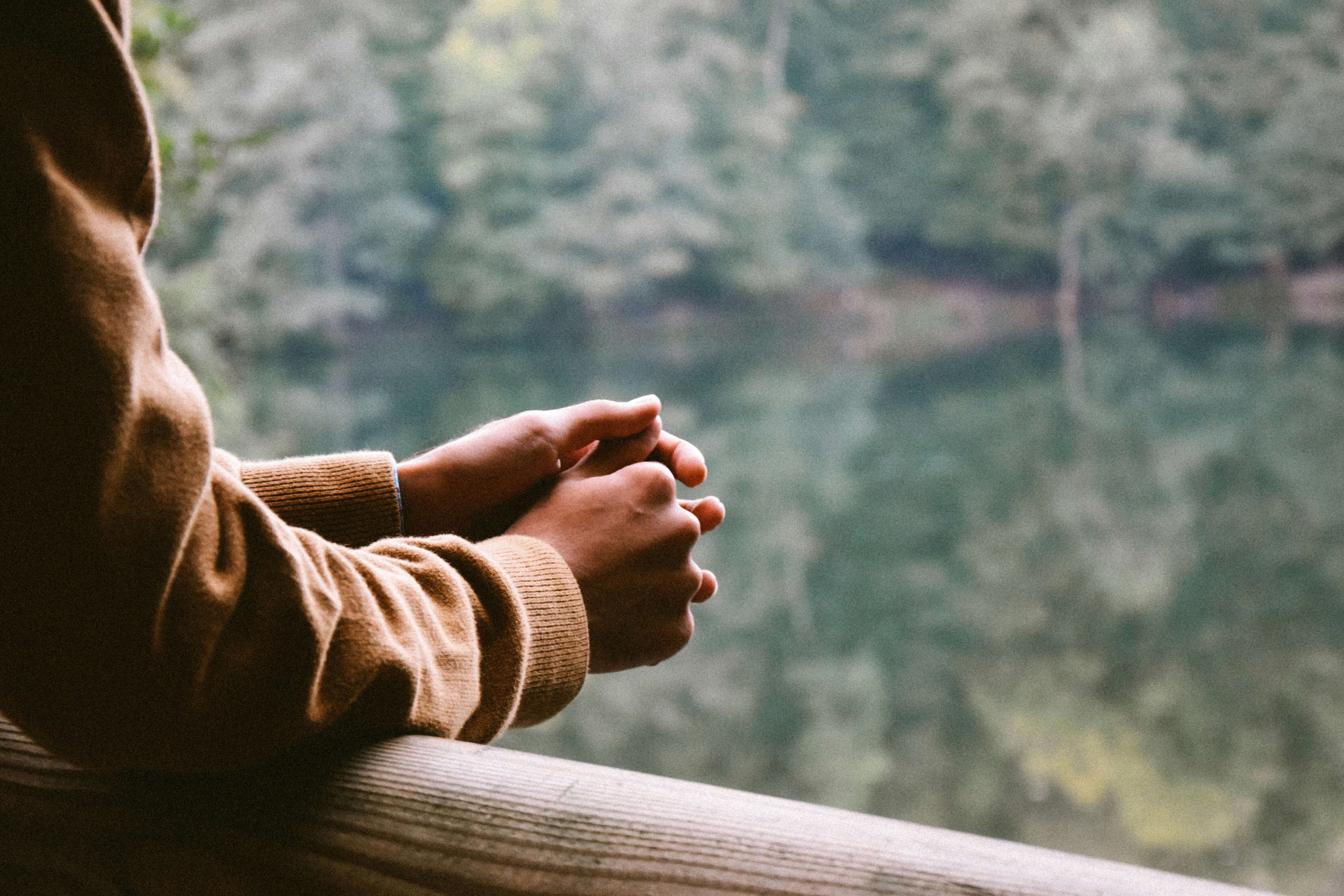 Person sitting by the water